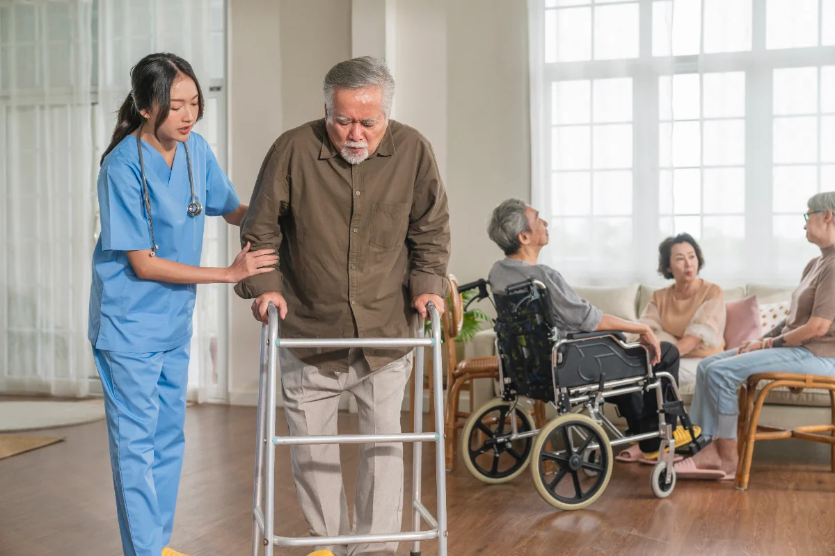 A caregiver and client together in a sunlit home